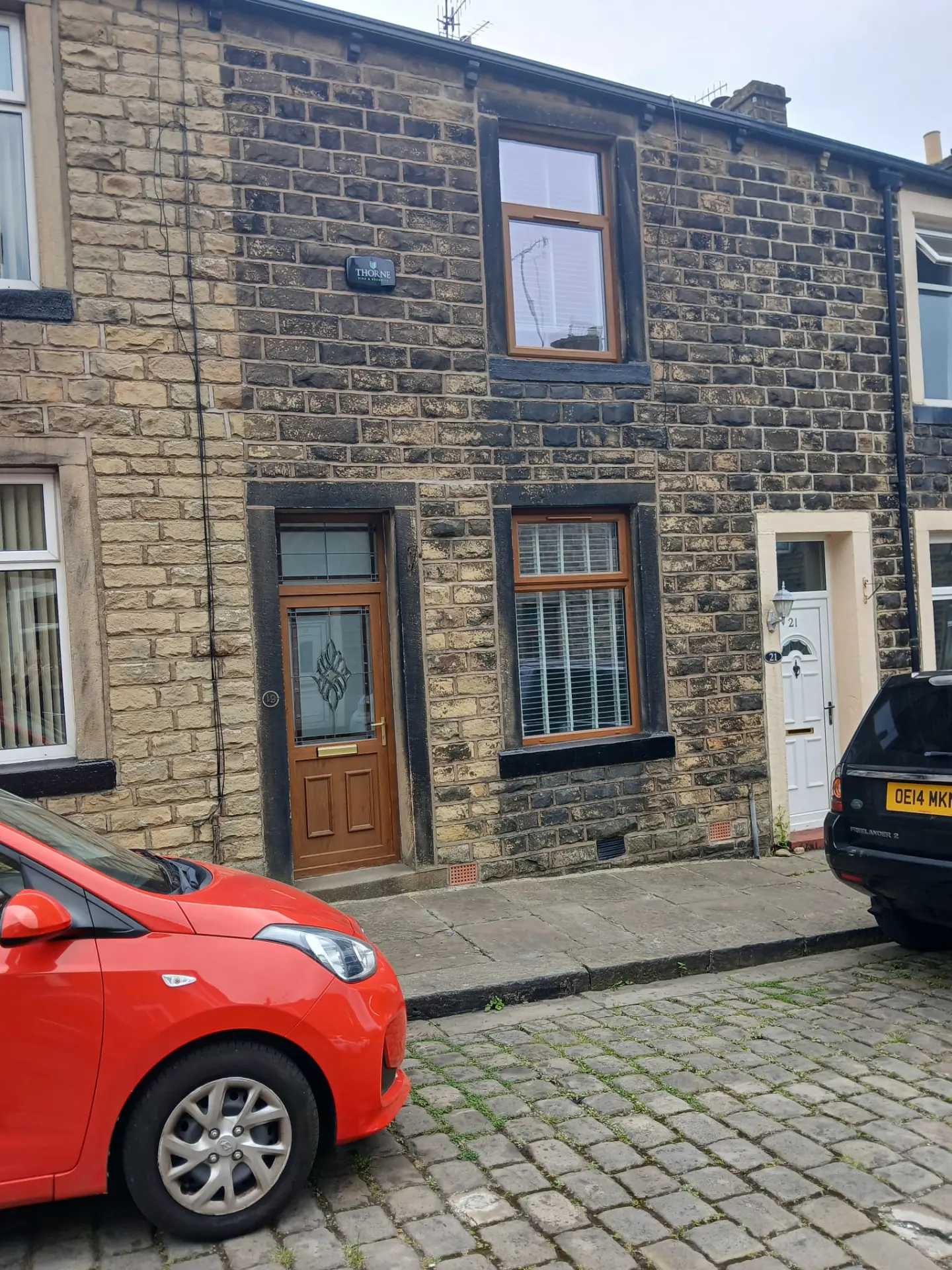 Stone-fronted Lancashire terrace we sourced, with timber door and shuttered windows